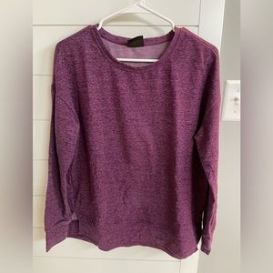 Athletic plum colored crewneck sweatshirt.